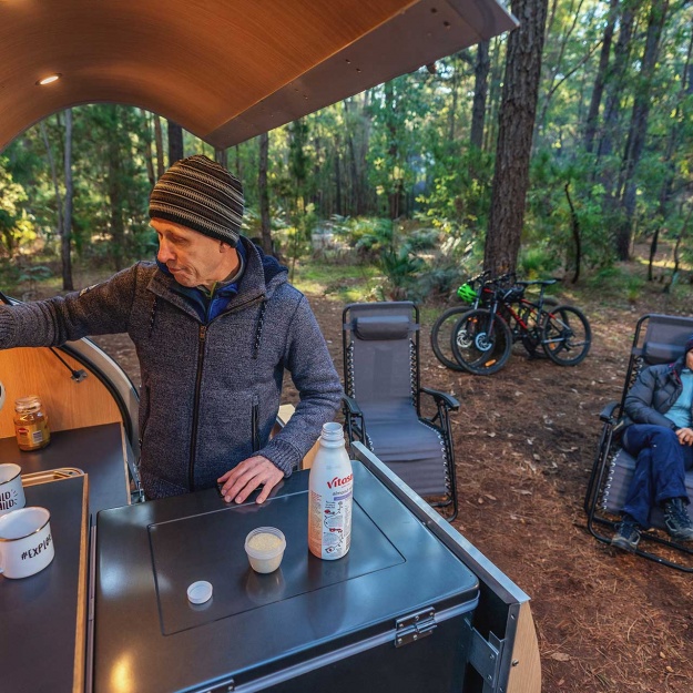 Lane_Poole_Reserve_Camping_Couple_Camper_Trailer_Man_Making_Coffee_Woman_Sittting-credit-Josh-Cowling